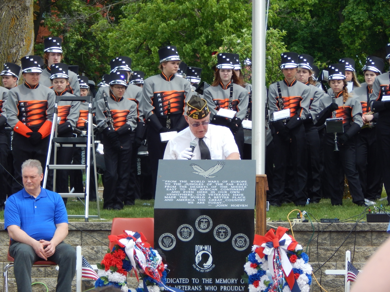 Officer of the Day Mel Rabideau addresses the crowd
